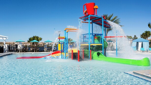 A water park with a pool, slides, and play structures. - Spacious 9-bedroom house in serene Kissimmee with AC (Kissimmee)