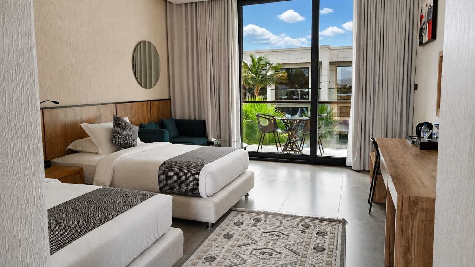 Twin Room, Balcony, Pool View | In-room safe, blackout curtains, soundproofing, iron/ironing board