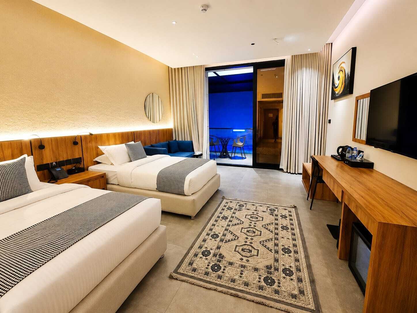 Deluxe Twin Room, Patio, Courtyard View | In-room safe, blackout curtains, soundproofing, iron/ironing board