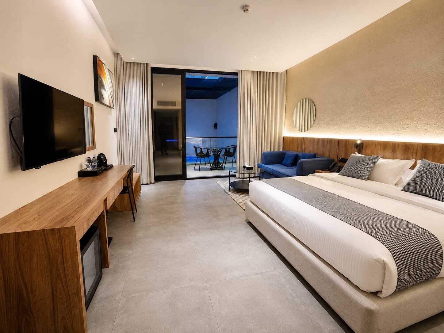 Deluxe Double Room, Patio, Courtyard View | In-room safe, blackout curtains, soundproofing, iron/ironing board