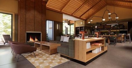 A modern living room with a fireplace, a sofa, a coffee table, and a bar area with stools.
