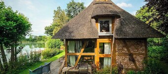 Fisher's cottage by lake with magical garden