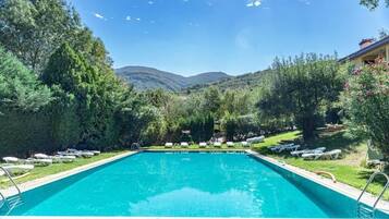 Seasonal outdoor pool, pool umbrellas, pool loungers