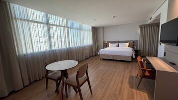 Junior Suite | Minibar, in-room safe, laptop workspace, iron/ironing board