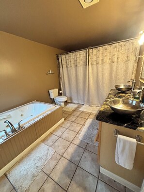 Jetted bath, hair dryer, towels, soap