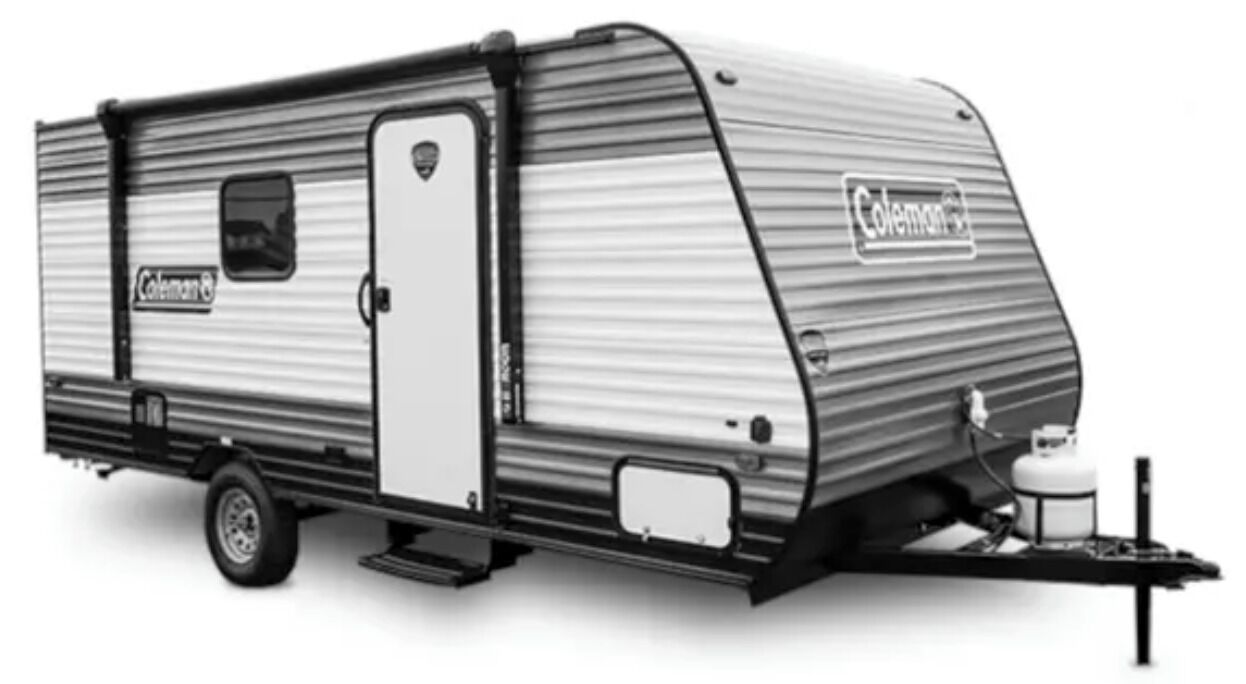 A Coleman RV with a sliding door, a small window, and a front-mounted water heater.