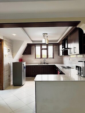 Family Apartment | Private kitchen | Fridge, microwave, cookware/dishes/utensils - Havillah Bustani Apartments (Diani Beach)