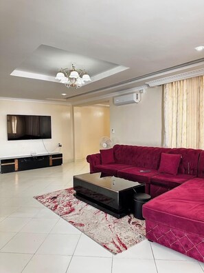 Family Apartment | Living area | 24-inch Smart TV with digital channels - Havillah Bustani Apartments (Diani Beach)