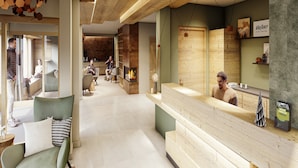 A modern interior with a reception desk, seating area, and a fireplace. - Rental Near Vaujany Ski Lifts (Vaujany)