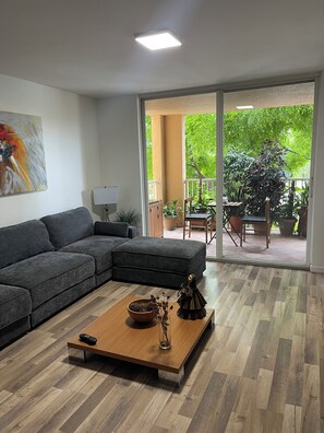 Living area - Walking distance to Beach and Mall Cozy modern apartment relaxing view of trees (Miami)