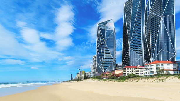 A beach with modern skyscrapers in the background. - Bliss On Beach Parade (Surfers Paradise)