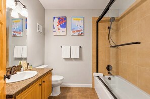 A bathroom with a sink, toilet, and bathtub. There are two towels hanging on the wall. - Spacious 3-Bedroom Townhome in the Prospector Neighborhood w/ Private Hot Tub! CCT-2180 by KBM (Park City)