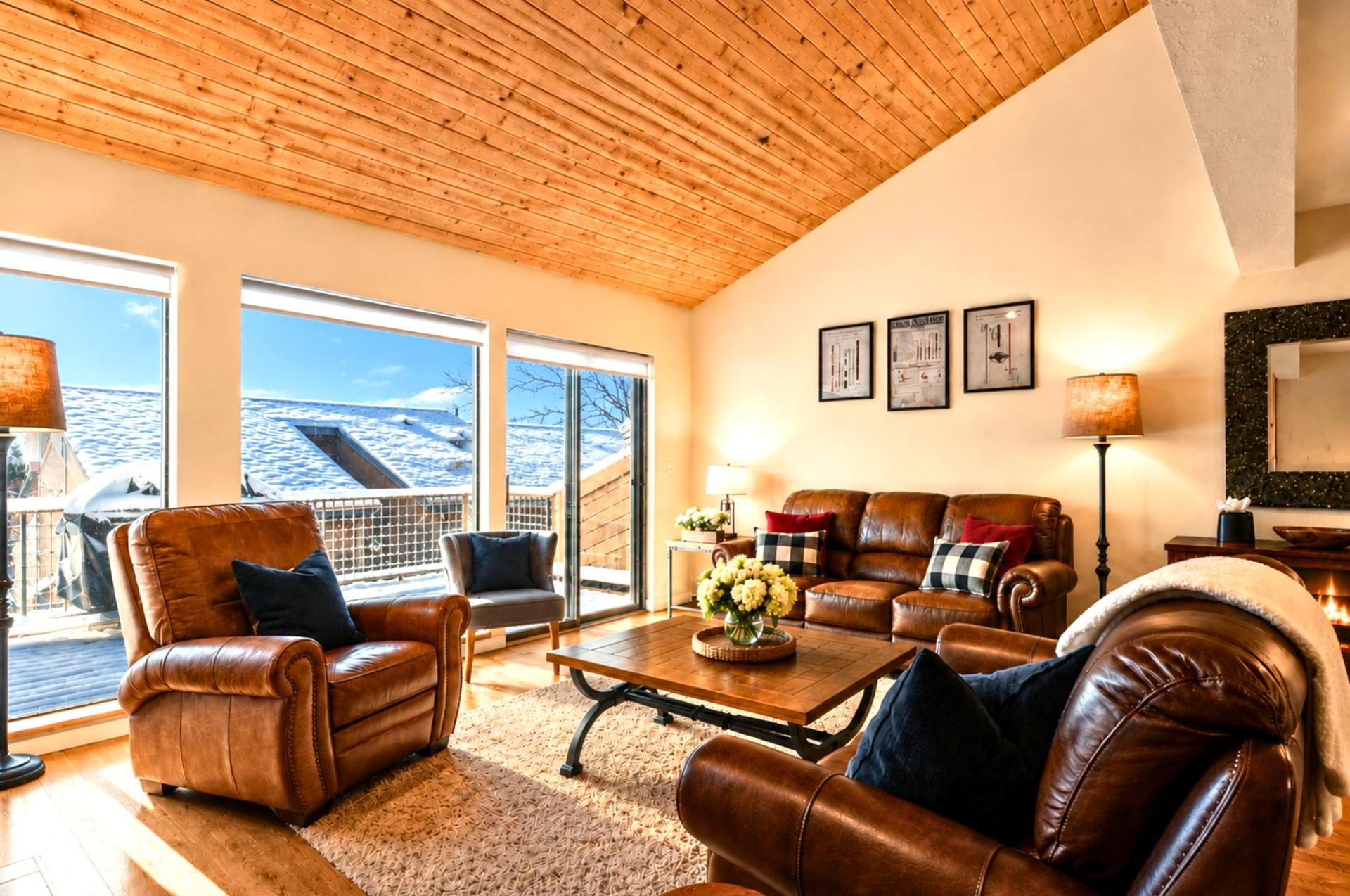 An entire wall of windows to watch the snow fall on blistery winter days, while you stay warm, cuddled up by the fire.