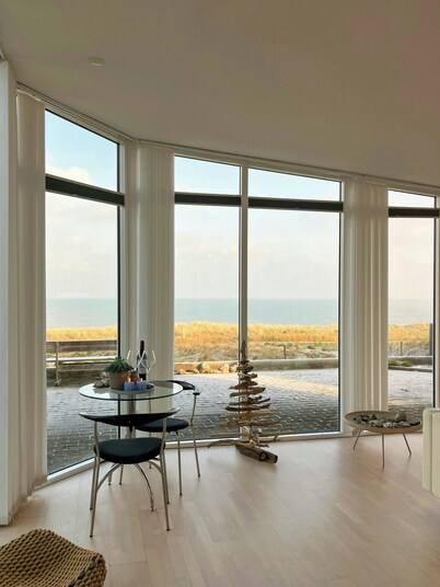 Restored fisherman's house on cliff in Thy