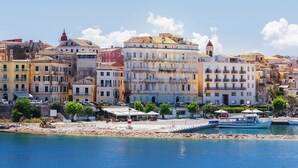 A coastal cityscape with colorful buildings, a marina, and a construction site. - Koryfo Old Town Stay by Corfuescapes (Kerkira)