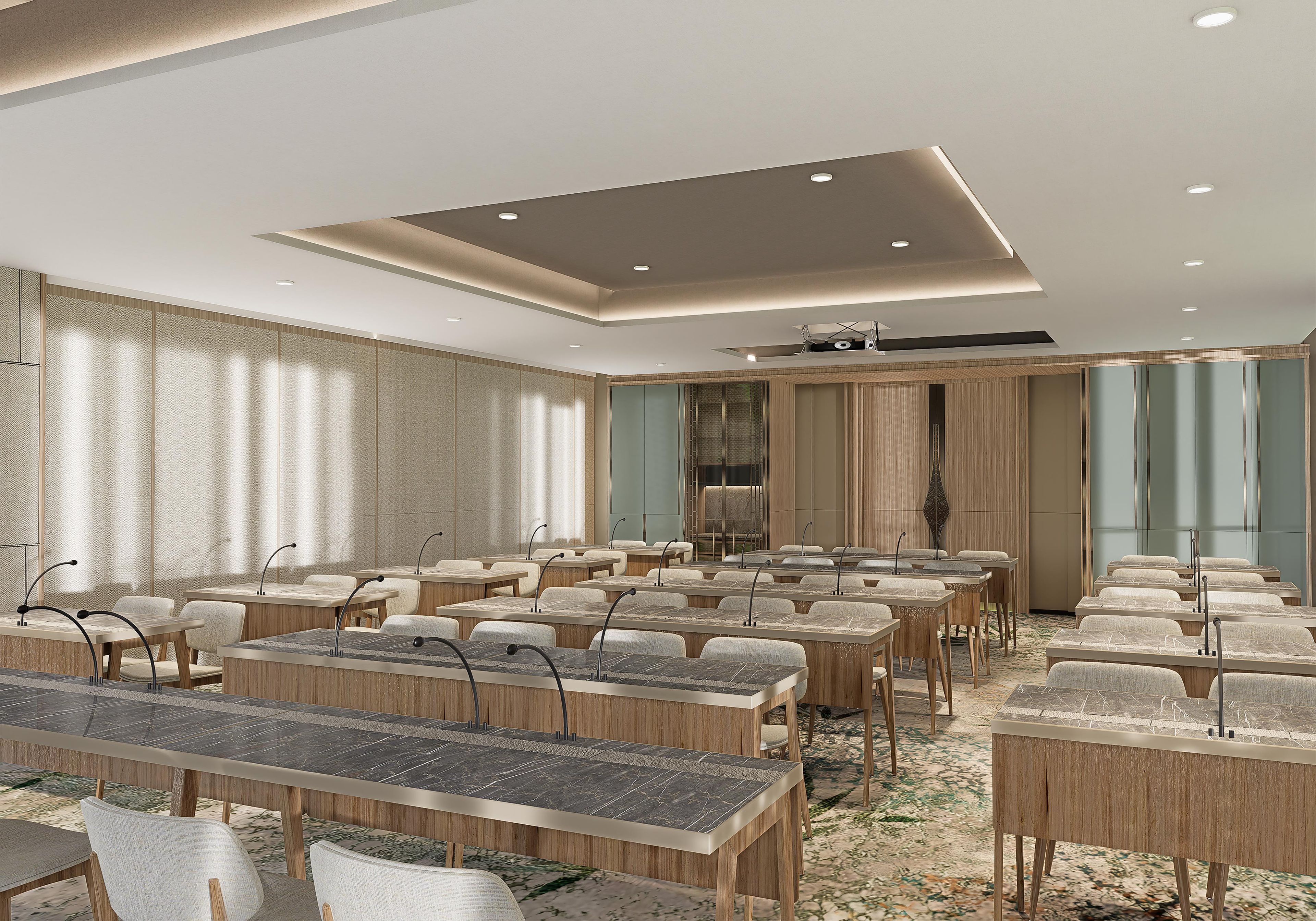 A conference room with multiple tables and chairs, a ceiling with recessed lighting, and a large window with curtains.