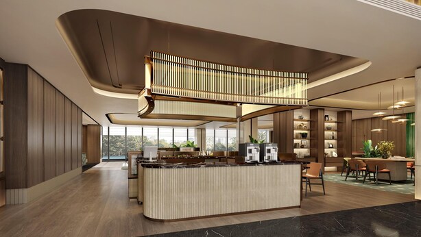 A modern hotel lobby with a central island, wooden paneling, and a mezzanine level.