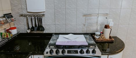 Fridge, microwave, oven, cookware/dishes/utensils