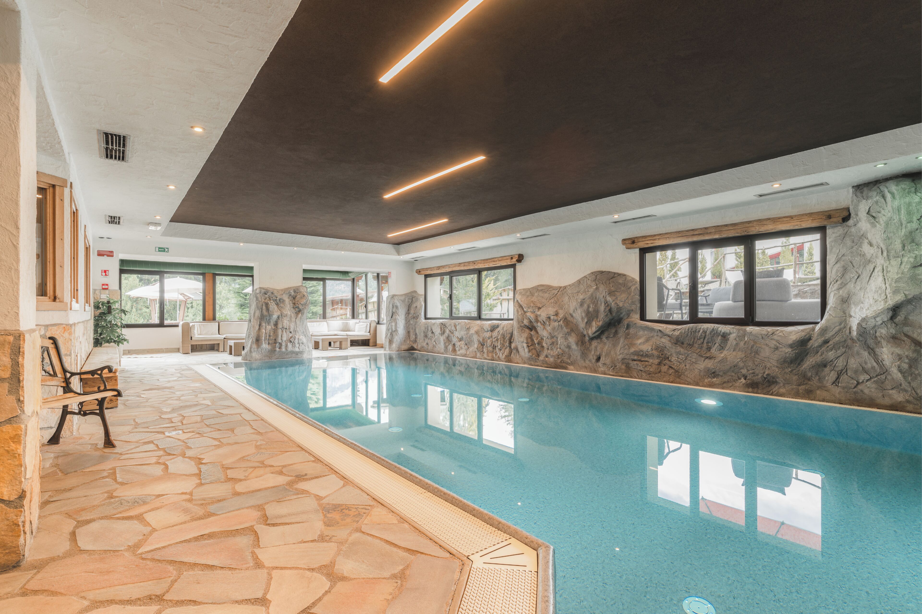 Indoor pool, open 10:00 AM to 7:30 PM, pool loungers