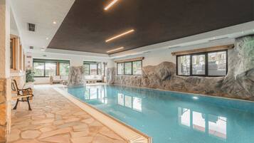 Indoor pool, open 10:00 AM to 7:30 PM, pool loungers