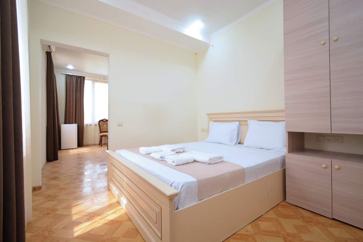 Deluxe Apartment, City View | Desk, laptop workspace, free WiFi, bed sheets
