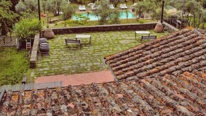 A terraced garden with a pool, outdoor seating, and a view of rolling hills. - Azienda agricola la camporena  (Greve in Chianti)