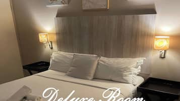 Habitación Deluxe doble | Tabla de planchar con plancha, wifi gratis, ropa de cama