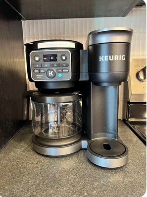 A Keurig coffee maker with a glass carafe and a reusable coffee filter. - Brick & Bed - Riverfront Loft - Convention Center (St. Louis)