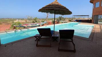 Outdoor pool, open 8:00 AM to 10:00 PM, pool umbrellas, sun loungers