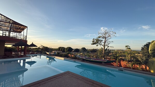 Outdoor pool, open 8:00 AM to 10:00 PM, pool umbrellas, pool loungers