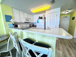 Fridge, microwave, oven, stovetop - 2 BR Oceanfront Condo with Shared Pool & Hot Tub (Panama City Beach)