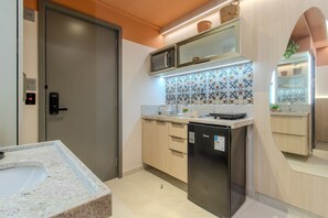 Superior Apartment | Bathroom | Shower, hair dryer, towels, toilet paper - Garden Haus (João Pessoa)