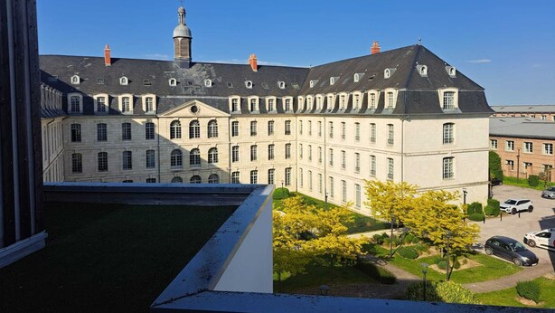 A large, historic building with multiple windows and a symmetrical facade. - Cosy studio • 5 min from station and center - Very bright and quiet (Amiens)