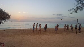 On the beach, sun loungers, beach umbrellas, beach towels - Roots Cafe Negril (Negril)