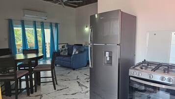 Luxury Suite, Sea View | Private kitchen | Highchair