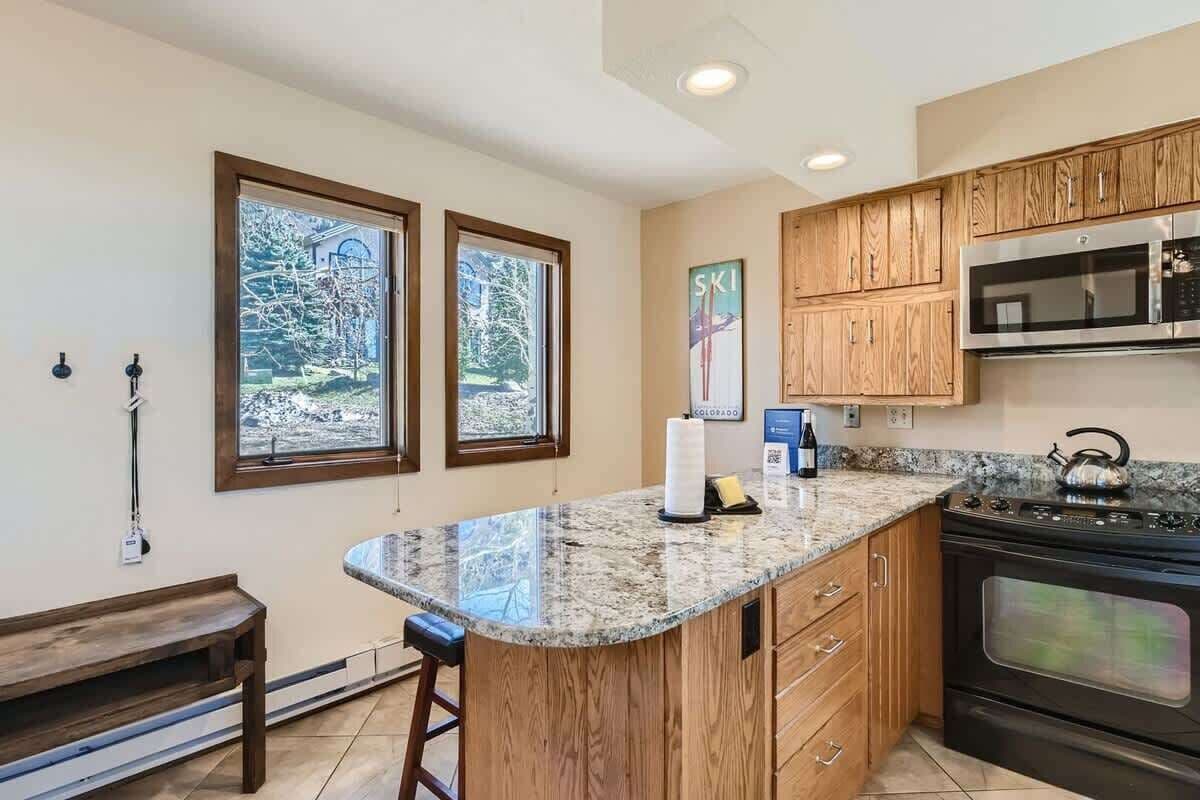 Maison mitoyenne, plusieurs lits, patio, vue montagne (A-D-111CTR) | Cuisine privée