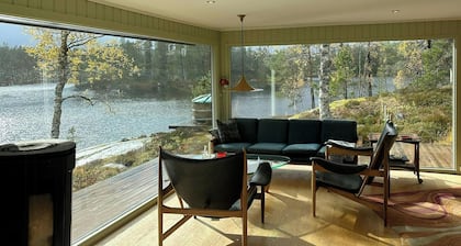 Design cabin by mountain lake in Rukkedalen