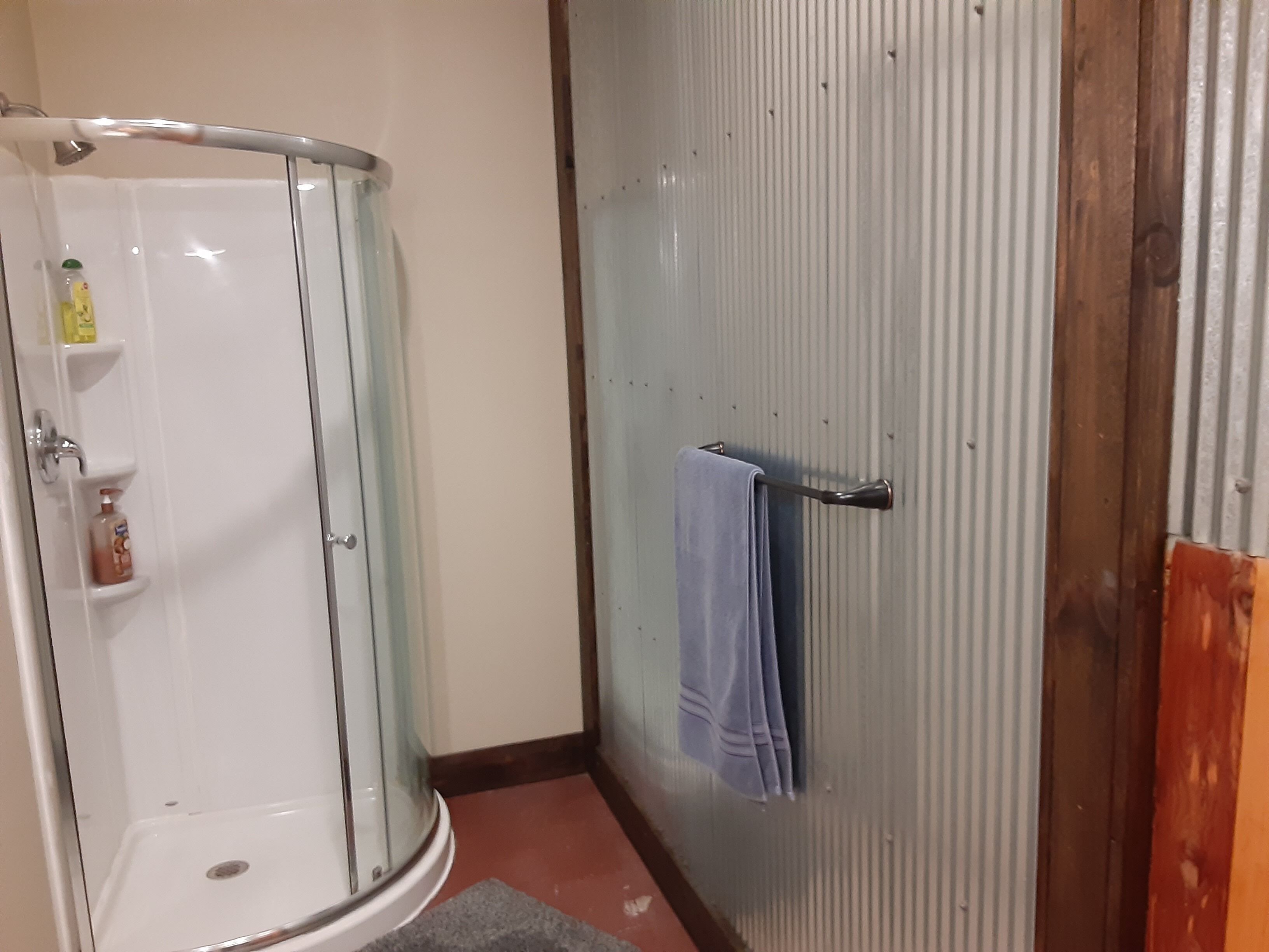 Shower, towels, soap, toilet paper