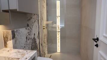 Shower, hair dryer, towels, soap