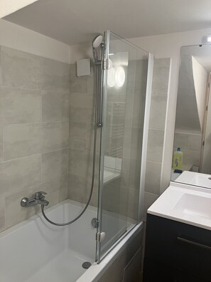 Jetted bath, hair dryer, soap, toilet paper