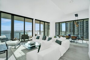Living area - Edgewater condo w/ all amenities w/sweeping water views.  1 month rental min. (Miami)