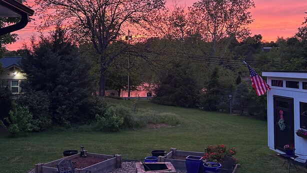 A backyard with a fire pit, seating area, and an American flag. - Lakeview 1BR/1BA guest suite, pickleball, fishing, close to Asheville & BRP. (Weaverville)