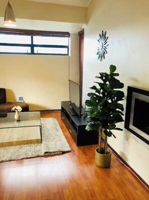 Living area - 1 bedroom apartment in a secure Golf Estate in Northriding, has Wifi and Netflix (Roodepoort)
