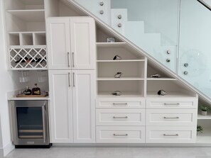 A modern kitchen with white cabinetry, a built-in wine cooler, and a stainless steel refrigerator. - Enjoyable 2-bedroom condo with AC in charming Savannah (Savannah)