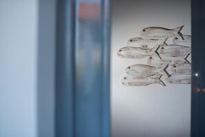 A wall with a fish-themed decoration. - AVALI GAIOS PAXOS  CITY SEA VIEW BEACH PARKING (Gaios)