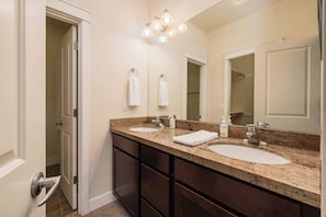 Shower, hair dryer, towels, shampoo