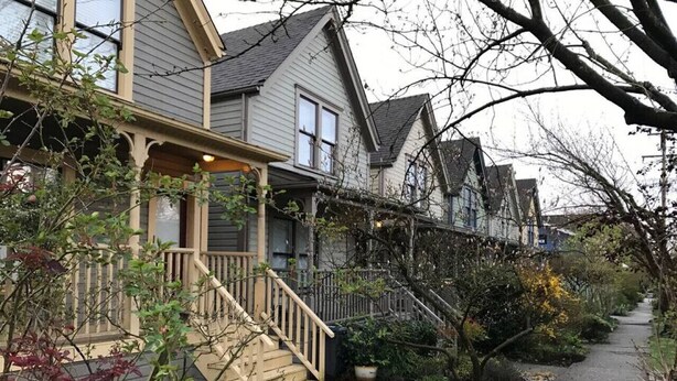 A residential area with houses, a wooden staircase, and a pathway. - Charming Character-filled Heritage Home near DT (Vancouver)
