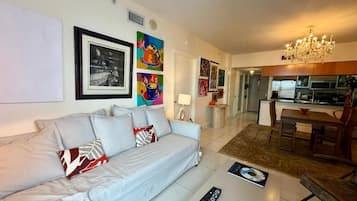 Apartment, Balcony, City View | Living area | Flat-screen TV, computer monitors