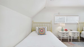 A bedroom with a single bed, a bedside table with a lamp, and a window with blinds. - Bon Villa 102-Golf Cart + Private Pool-Sleeps 10 (Seagrove Beach)