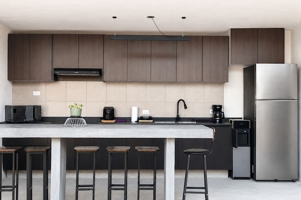 Full-size fridge, microwave, stovetop, cookware/dishes/utensils